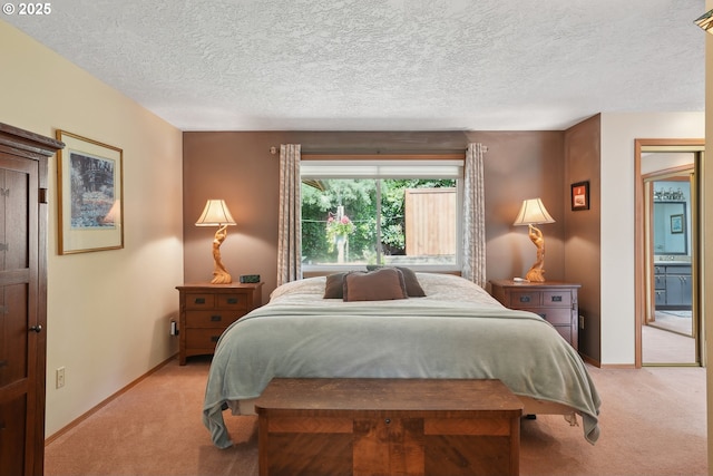bedroom with light colored carpet, a textured ceiling, and baseboards