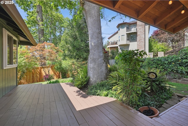 wooden deck featuring a fenced backyard