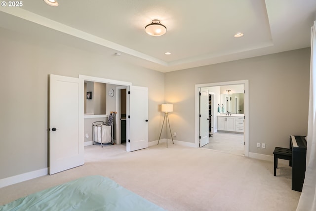 7414 SW 80th Ter, Portland, OR 97223 - unfurnished bedroom featuring recessed lighting, light carpet, a tray ceiling, and connected bathroom