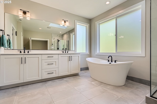 7414 SW 80th Ter, Portland, OR 97223 - full bath with a shower stall, double vanity, a soaking tub, tile patterned flooring, and recessed lighting