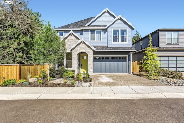 7414 SW 80th Ter, Portland, OR 97223 - view of front of home with stone siding, an attached garage, driveway, and roof with shingles