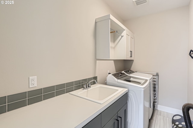 7414 SW 80th Ter, Portland, OR 97223 - laundry room featuring cabinet space, separate washer and dryer, and light tile patterned floors