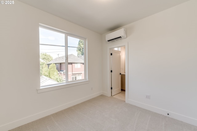 3727 N Michigan Ave, Portland, OR 97227 - spare room featuring an AC wall unit and light carpet