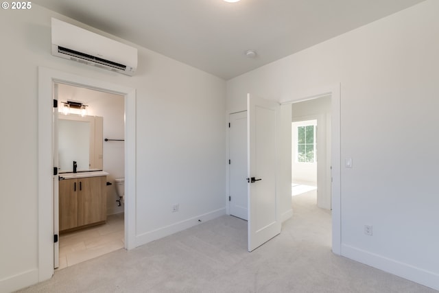 3727 N Michigan Ave, Portland, OR 97227 - unfurnished bedroom featuring a wall mounted air conditioner, light carpet, and connected bathroom