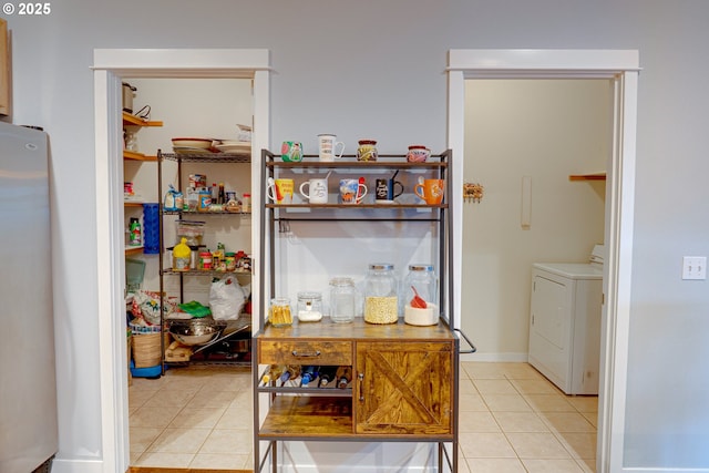 pantry featuring separate washer and dryer