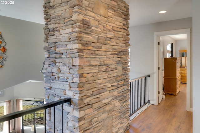 hallway with wood-type flooring