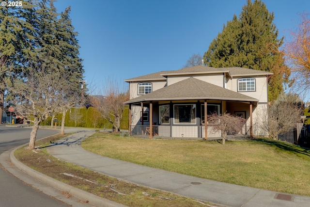 view of front of property featuring a front yard and a porch