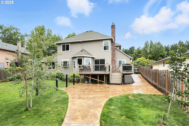 18135 SW Hart Dr, Beaverton, OR 97007 - rear view of property with a deck, a patio, a shingled roof, and a chimney