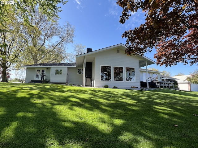 1082 E Highland Ave, Hermiston, OR 97838 - rear view of house with a yard, french doors, and a chimney