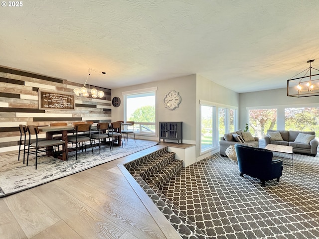 1082 E Highland Ave, Hermiston, OR 97838 - living room featuring a chandelier, wood finished floors, and a textured ceiling