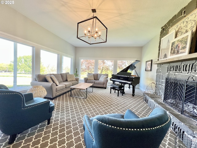 1082 E Highland Ave, Hermiston, OR 97838 - carpeted living room with a chandelier, a fireplace, and baseboards