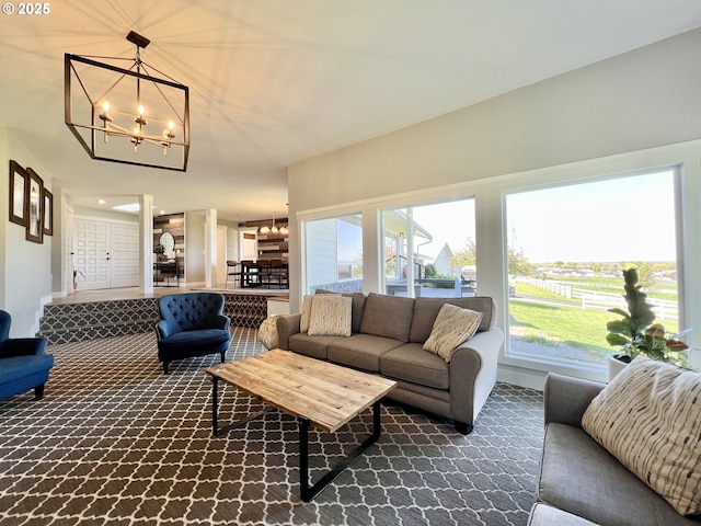 1082 E Highland Ave, Hermiston, OR 97838 - living area with a chandelier, dark carpet, and baseboards