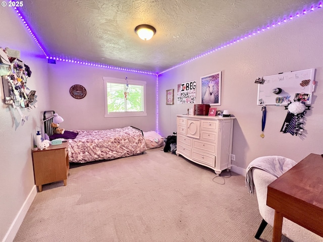 1082 E Highland Ave, Hermiston, OR 97838 - bedroom with light carpet, a textured ceiling, and baseboards