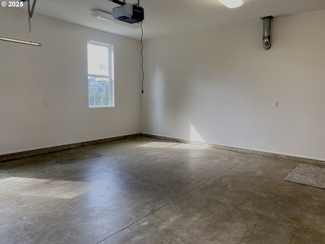 garage featuring baseboards and a garage door opener