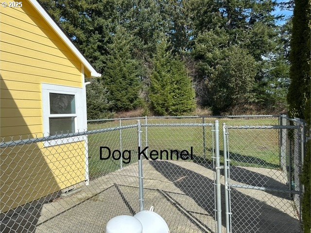 exterior space featuring a gate and fence