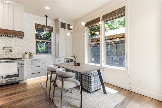 8614 SW Logan Ln, Tualatin, OR 97062 - dining area featuring healthy amount of natural light, light wood-type flooring, and baseboards