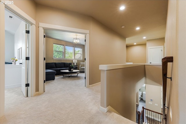 8614 SW Logan Ln, Tualatin, OR 97062 - hallway with carpet floors, an upstairs landing, recessed lighting, baseboards, and a chandelier