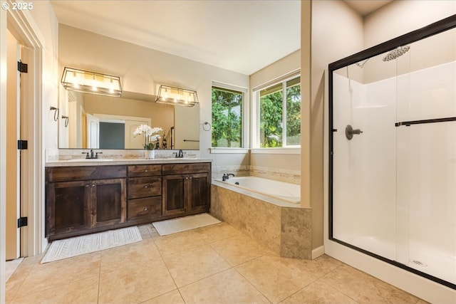 8614 SW Logan Ln, Tualatin, OR 97062 - bathroom featuring a bath, a shower stall, tile patterned floors, and double vanity