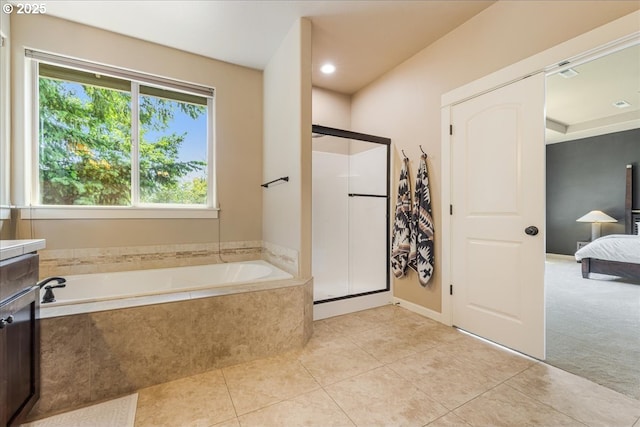 8614 SW Logan Ln, Tualatin, OR 97062 - full bathroom with tile patterned flooring, a shower stall, a garden tub, and ensuite bath