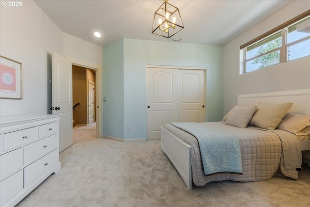 8614 SW Logan Ln, Tualatin, OR 97062 - bedroom featuring light colored carpet, a chandelier, a closet, baseboards, and recessed lighting