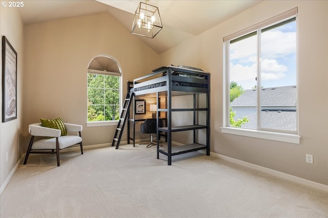 8614 SW Logan Ln, Tualatin, OR 97062 - carpeted bedroom featuring baseboards, lofted ceiling, and a chandelier