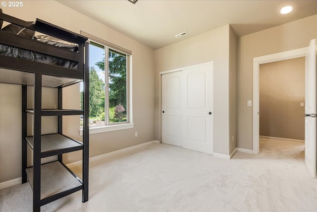8614 SW Logan Ln, Tualatin, OR 97062 - unfurnished bedroom with carpet floors, baseboards, and a closet