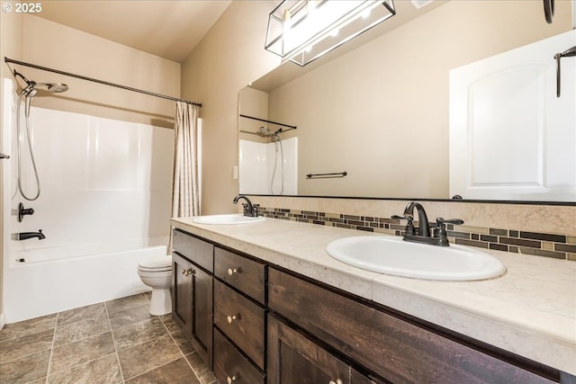 8614 SW Logan Ln, Tualatin, OR 97062 - full bath featuring toilet, backsplash, shower / bathtub combination with curtain, double vanity, and stone finish flooring