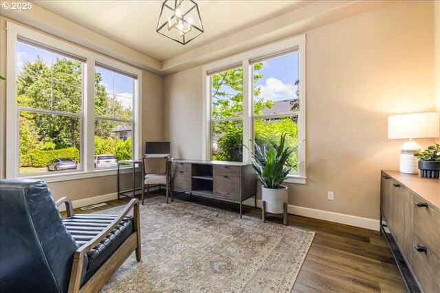 8614 SW Logan Ln, Tualatin, OR 97062 - living area with baseboards, healthy amount of natural light, and wood finished floors