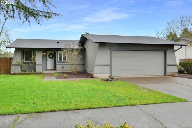 view of front of house with stucco siding, a front lawn, fence, concrete driveway, and an attached garage