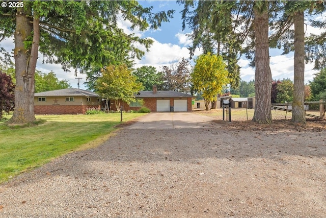 3574 SE Jefferson Marion Rd, Jefferson, OR 97352 - ranch-style house featuring concrete driveway, brick siding, and a chimney