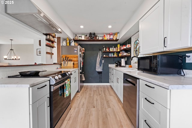 35208 Orchard Ln, Astoria, OR 97103 - kitchen featuring appliances with stainless steel finishes, a sink, wall chimney range hood, open shelves, and light wood finished floors