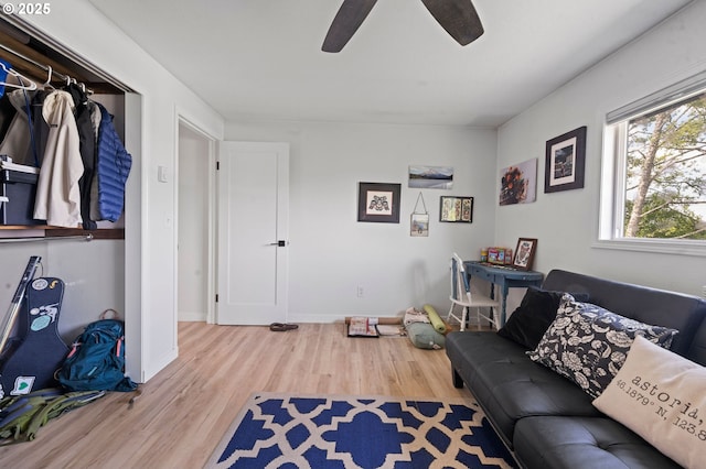 35208 Orchard Ln, Astoria, OR 97103 - living room with wood finished floors, a ceiling fan, and baseboards