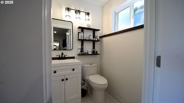 35208 Orchard Ln, Astoria, OR 97103 - half bathroom with toilet, vanity, and tile patterned flooring