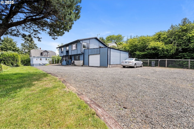35208 Orchard Ln, Astoria, OR 97103 - view of front of property featuring a garage and gravel driveway