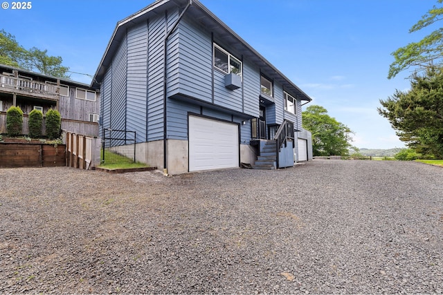 35208 Orchard Ln, Astoria, OR 97103 - back of house with an attached garage and driveway