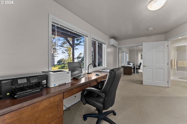 office area featuring a wall mounted AC and a textured ceiling