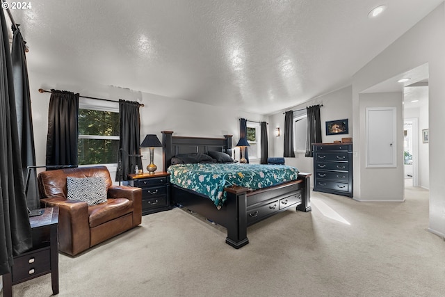 carpeted bedroom featuring a textured ceiling