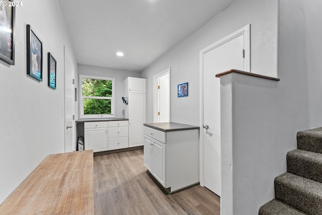 kitchen featuring light hardwood / wood-style floors and white cabinets