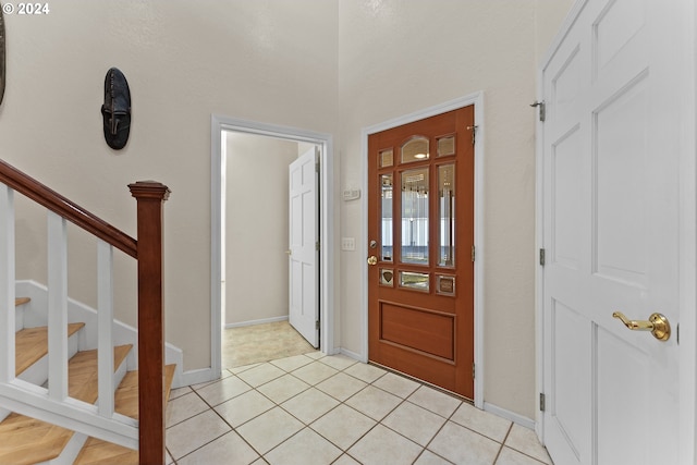 foyer entrance featuring light tile patterned floors