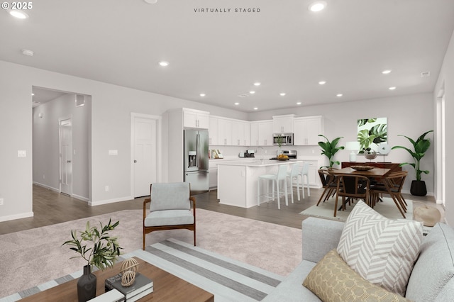 1587 Logan Pkwy SE, Albany, OR 97322 - living area featuring dark wood-style flooring, recessed lighting, and baseboards
