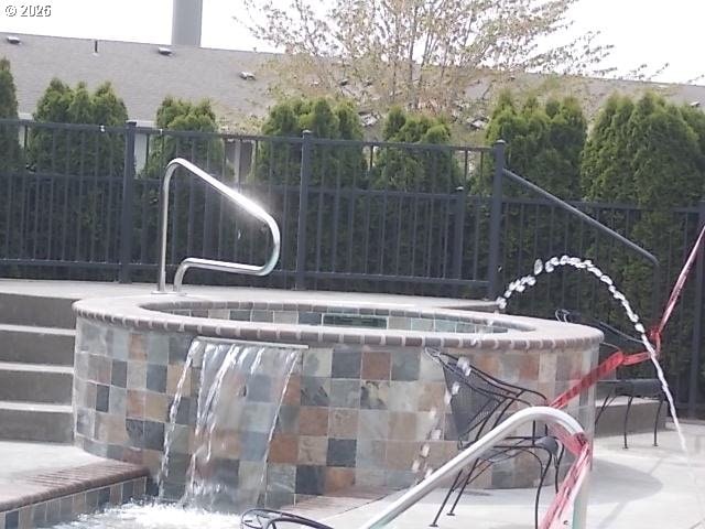 view of pool with fence