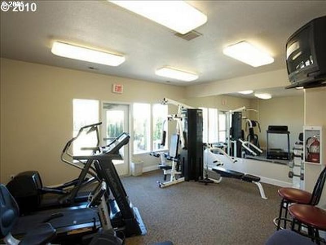 gym featuring visible vents and baseboards