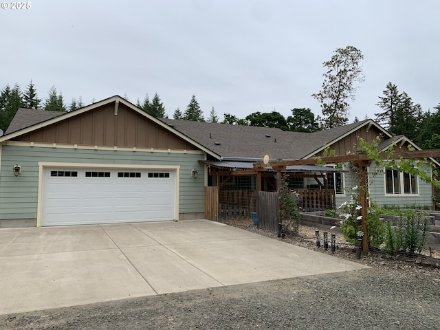 24945 Oak Ln, Elmira, OR 97437 - view of front facade with a shingled roof, an attached garage, and driveway