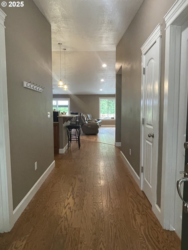 24945 Oak Ln, Elmira, OR 97437 - hall with baseboards, wood finished floors, and recessed lighting