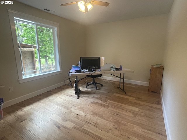 24945 Oak Ln, Elmira, OR 97437 - office area featuring light wood-style flooring, ceiling fan, and baseboards