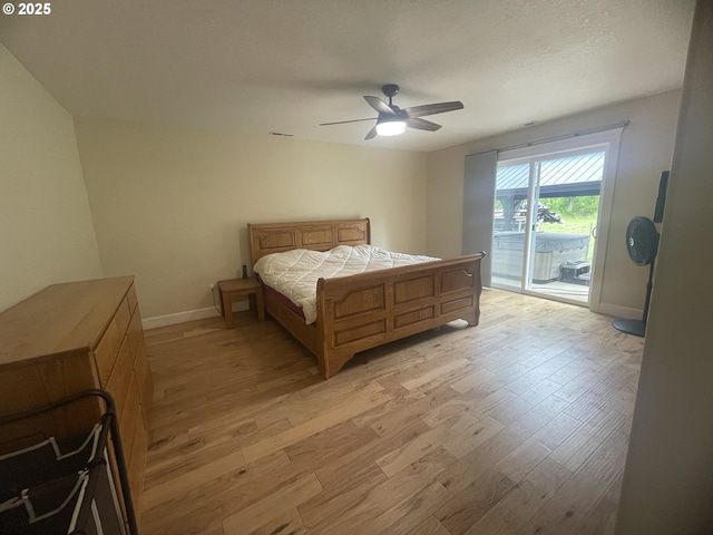 24945 Oak Ln, Elmira, OR 97437 - bedroom with access to exterior, light wood-style flooring, baseboards, and a ceiling fan