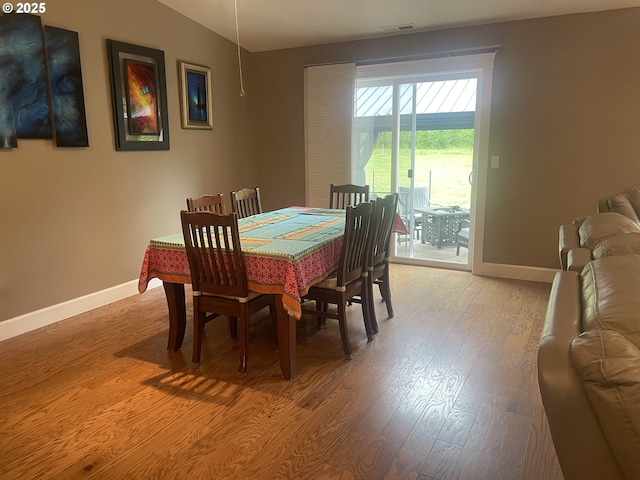 24945 Oak Ln, Elmira, OR 97437 - dining area with baseboards, light wood-style floors, and lofted ceiling
