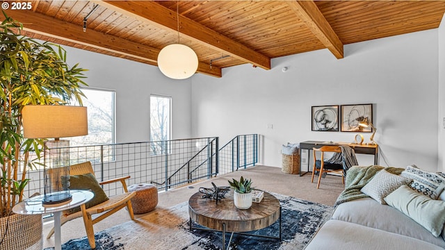 living room with beamed ceiling, carpet floors, and wood ceiling