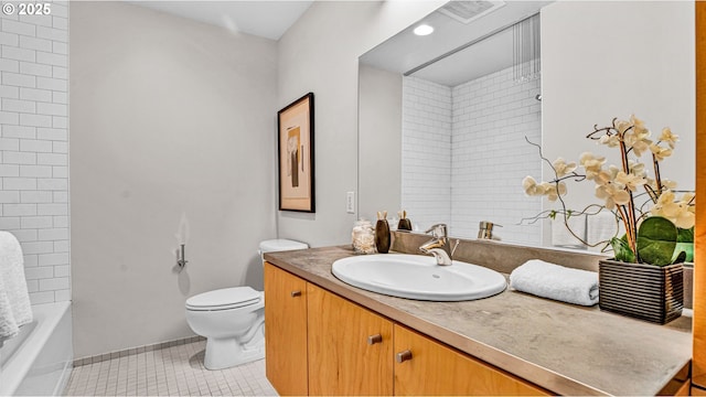 bathroom with vanity, toilet, and tile patterned flooring