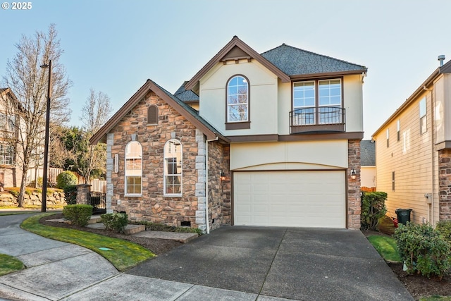 view of front of home with a garage and a balcony